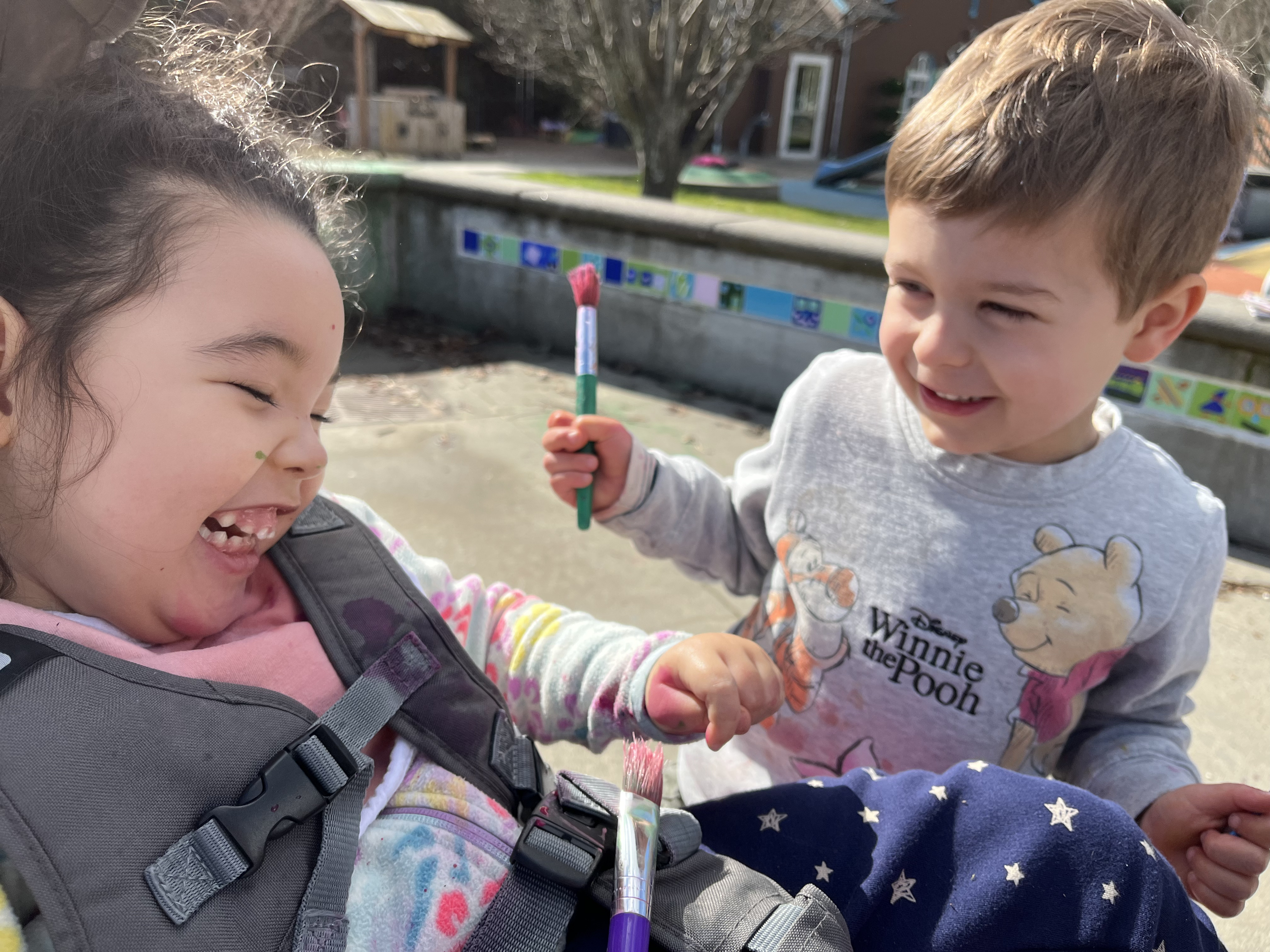 children smiling while playing